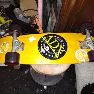 Yellow Skateboard with Stickers